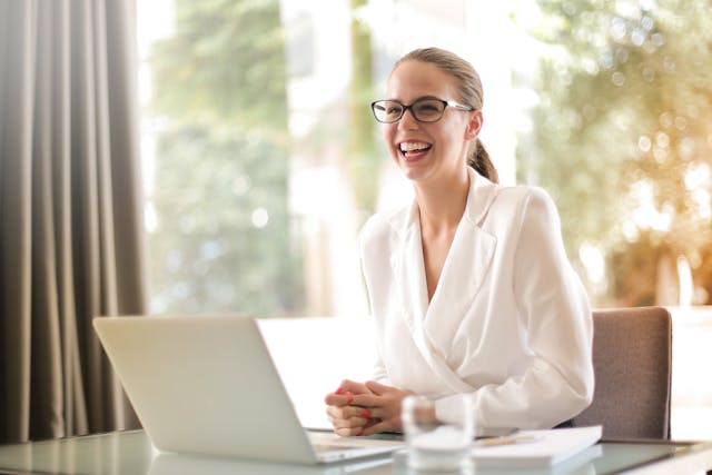 A smiling successful career lady in an office